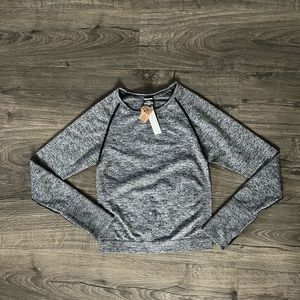 PINK perforated active long sleeve crop top size medium